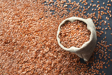 Flax seeds in linen burlap bag.