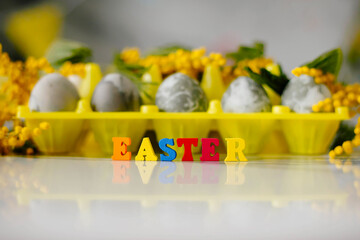 Letters Easter Background Colored Eggs. Postcard. Family Tradition Concept. Selective focus.