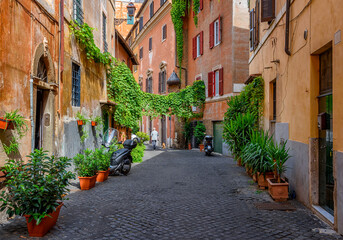 Old street in Trastevere, Rome, Italy. Trastevere is rione of Rome, on west bank of Tiber in Rome. Architecture and landmark of Rome