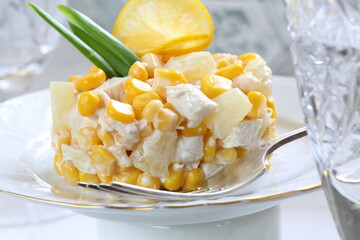 Salad with chicken, pineapple and corn with champagne