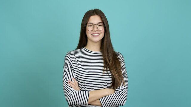 Teenager Brazilian girl with glasses smiling over isolated background