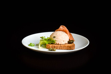 Salmon spread with capers on cracker