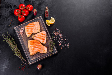 Fototapeta na wymiar Tasty fresh red fish arctic char baked on a grill