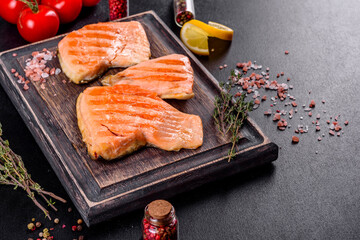 Tasty fresh red fish arctic char baked on a grill