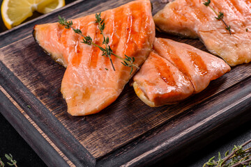 Tasty fresh red fish arctic char baked on a grill