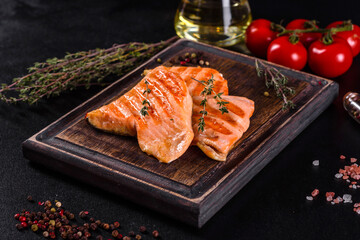 Tasty fresh red fish arctic char baked on a grill