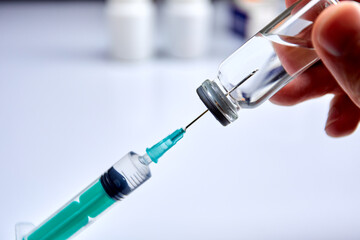  Vaccine in vial with syringe