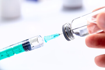  Vaccine in vial with syringe