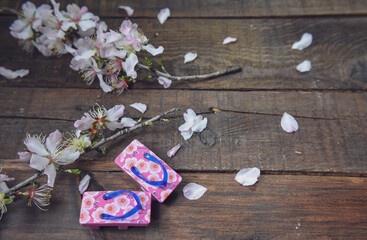 Obraz na płótnie Canvas Almond Flowers and Japanese Sandals On Wood
