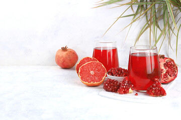 Fruit juice and ingredients, pomegranate summer drink and grapefruit on a bright table, Detox diet and weight loss concept, healthy and natural food, source of vitamins C, selective focus,