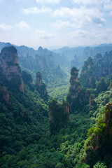 Naklejka premium Zhangjiajie Cliff Mountains - National Forest Park Landscape in China. Dark Avatar Mountains. Mysterious and gloomy cliffs. 