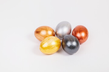Multi-colored eggs on a uniform white background with place for text.
