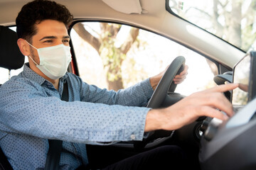 Man using gps navigation system in car.