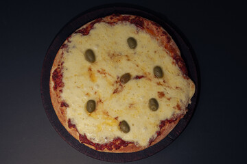 Home made cheese italian Pizza with tomate sauce and black background