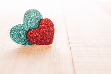 Fototapeta premium Valentines day minimal: red love hearts candle on wooden background. Sainte Valentine, mothers day, birthday greeting cards, invitation, celebration concept.