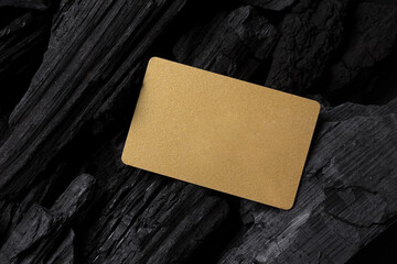 Blank gold gift card on charcoal, template for mockup design. Beauty and fashion, cosmetic products...