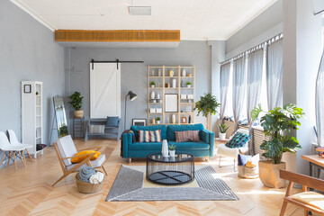 elegant creative modern trendy interior of a spacious open plan Scandinavian style studio with seating and sleeping areas