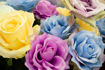 Fototapeta na wymiar Close up of artificial colorful roses flower bouquet.