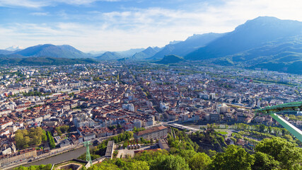 Fototapeta na wymiar Grenoble, a mesmerizing view of the city and the Alps from the observation deck, France, spring.