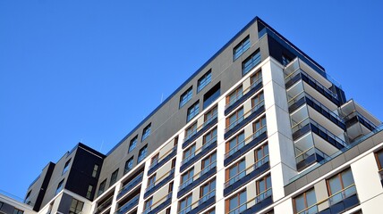 Fototapeta premium Modern apartment building in sunny day. Exterior, residential house facade.