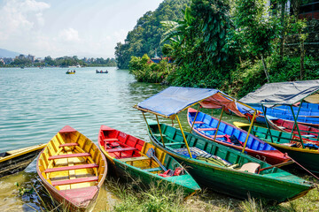 Nepal, Pokhara, colourful rowing boats on the Phewa Lake.