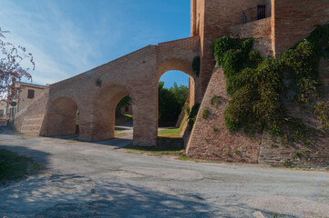 Long staircase leading to a brick castle and big arcs under it