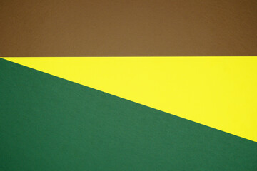 Brown, yellow, green three tone color paper background with stripes. Abstract background modern hipster futuristic. Texture design