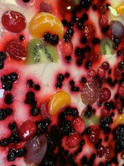 Festive gummy cake. Fruit pie with a creamy sweet filling. Dessert with fruits and berries.