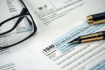 Filling US tax form. Tax form USA business income office concept. Tax Return Form 1040