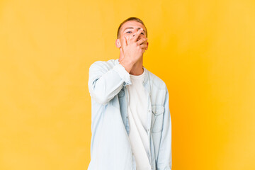 Young caucasian handsome man laughing happy, carefree, natural emotion.