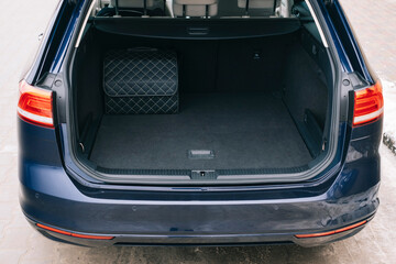 Car trunk. Open trunk. Seat of the second row of seats. Organizer in the trunk.
