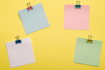 Promotions and discounts theme.Clips with a paper card template on a yellow background for text or...