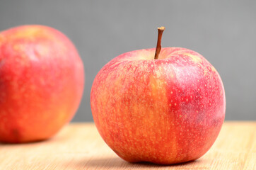 Ripe apples on wooden background