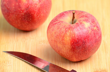 Ripe apples on wooden background