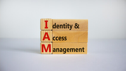 IAM, identity and access management symbol. Concept words 'IAM, identity and access management' on cubes and blocks on a beautiful white background. Business and IAM concept. Copy space.