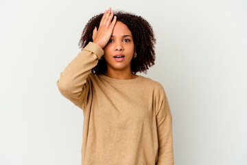 Young african american mixed race woman isolated forgetting something, slapping forehead with palm...