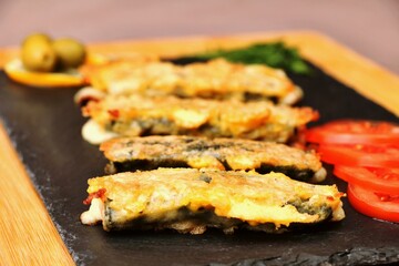 vegetarian dish cheese sticks on a black plate healthy food