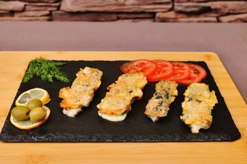 vegetarian dish cheese sticks on a black plate healthy food