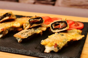 vegetarian dish cheese sticks on a black plate healthy food