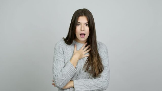 Teenager Brazilian girl gaping because have just surprised with a gift over isolated background