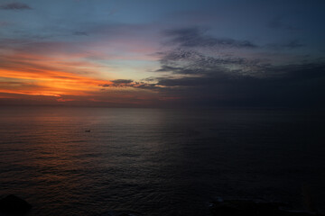 division of the dawn of the day with the darkness of night at Itanhaém beach on the north coast of the state of São Paulo