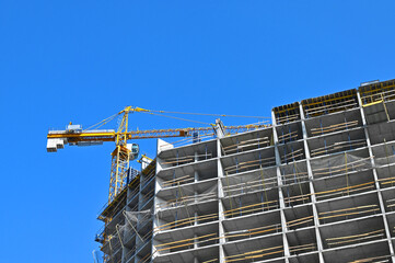 Crane and highrise construction site