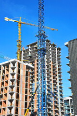 Crane and highrise construction site