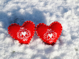 two hearts on the snow background