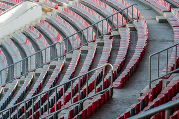 Fototapeta premium Empty football stadium chairs during the pandemic