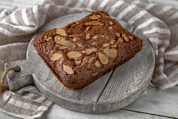 French mini chocolate cake with almonds. Bakery products. Sweet pastry.