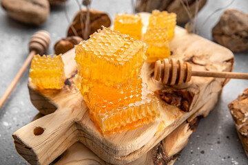 Honey comb. A useful fortified bee product for health and beauty. Vegetarian dietary organic product. Beautiful still life.