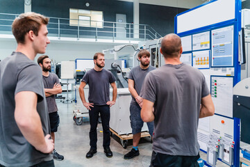 Expertise working together while standing in meeting at office