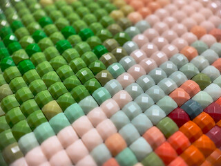 Close-up, colorful square diamond embroidery bright. Hobbies and entertainment.