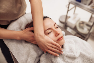 The woman is massaged face and body.